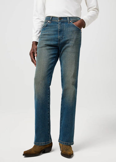 Men's Wrancher bootcut jeans in faded by Wrangler