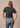 En la parte trasera de la camiseta de mujer «Home Grown» en negro de Kimes Ranch