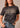 worn Women's Mountain Badge T-shirt in Black by Kimes Ranch