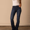 Women's Bootcut Jeans in blue by Kimes Ranch, featuring mid-rise fit and bootcut opening, styled with a white t-shirt.